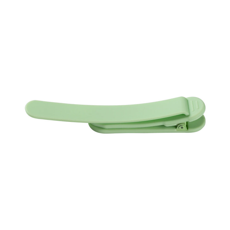 Silicone reading bookmark clip in light green, open claw design