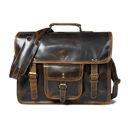 Dark brown leather laptop satchel with top handle, front flap, and buckle straps.
