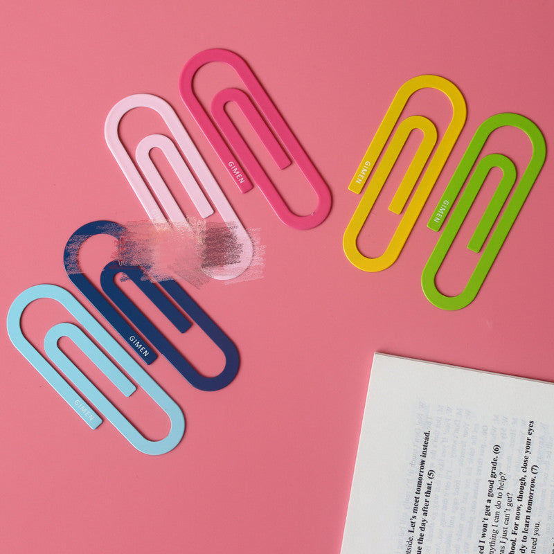Assorted U-shaped paper clip bookmarks in pink, blue, yellow, and green
