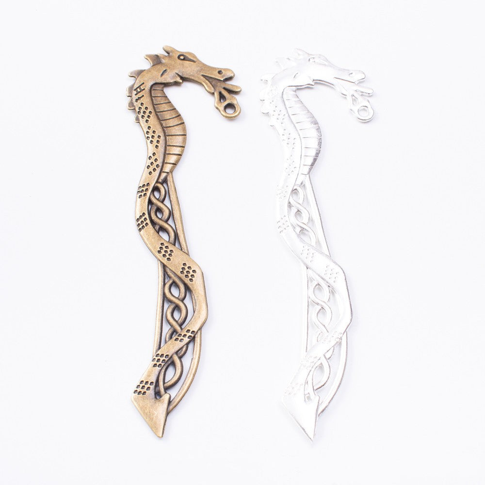 Pair of vintage seahorse bookmark charms in bronze and silver alloy