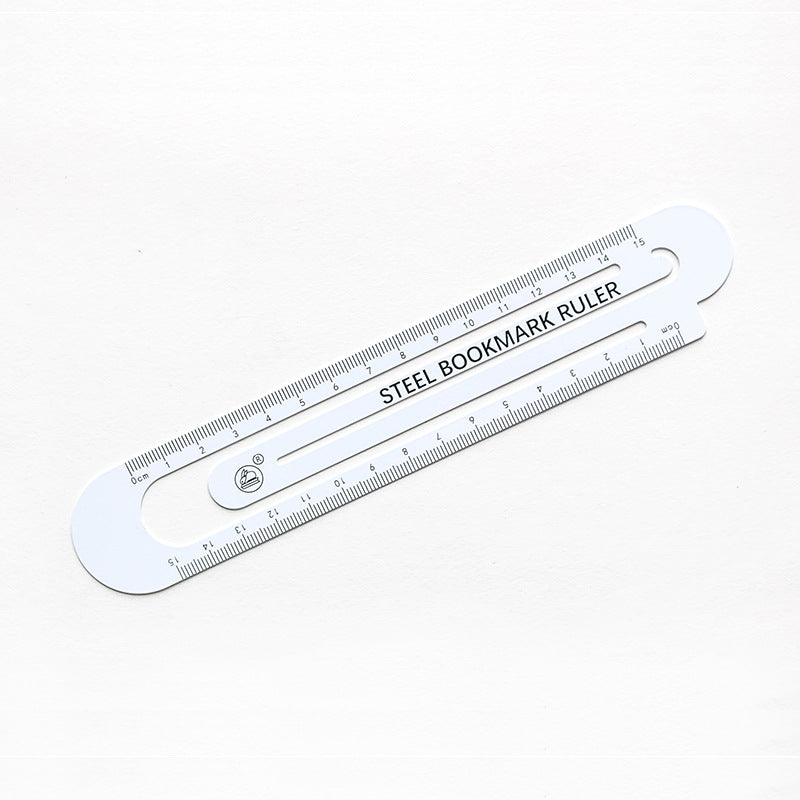 White steel bookmark ruler, hollow design with measuring markings and 12 cm scale.