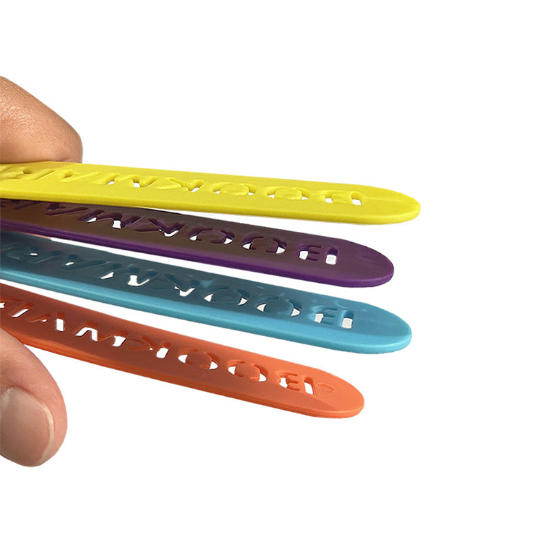 Stacked four-finger bookmarks: yellow, purple, teal, and orange with fingers holding