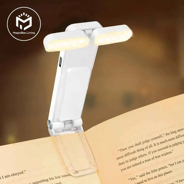 White clip-on book light with twin LED bars, adjustable head on clear clamp