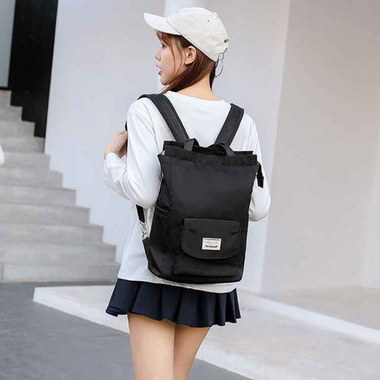 Black waterproof laptop backpack with padded back panel and dual shoulder straps