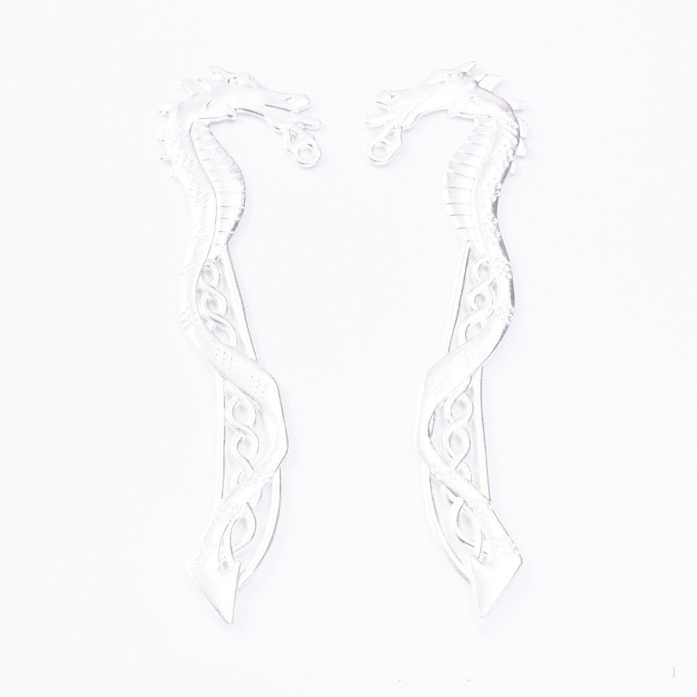 Two white-silver vintage seahorse bookmark charms, detailed filigree