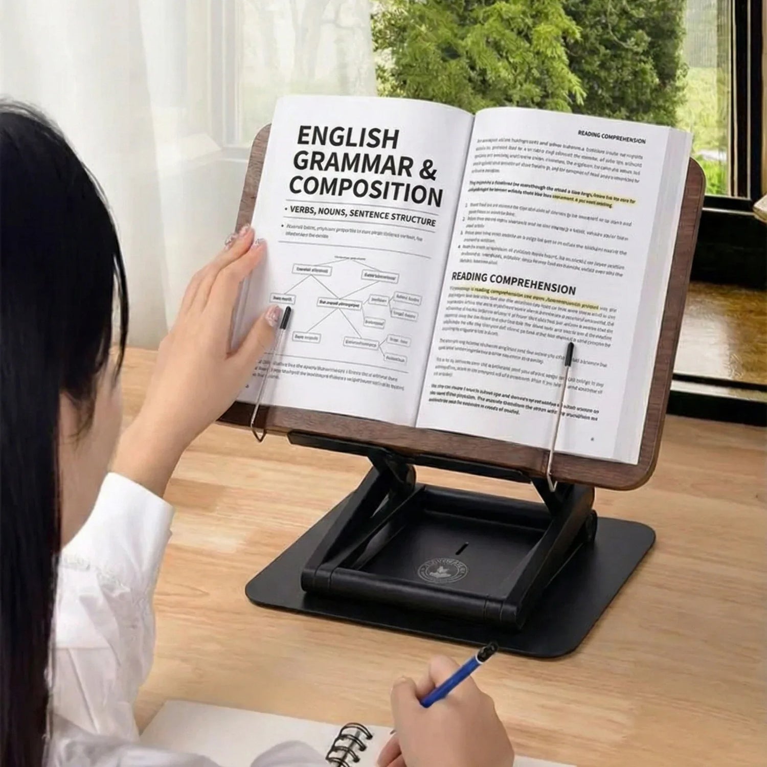 Student using adjustable book stand for studying with ergonomic posture and elevated textbook